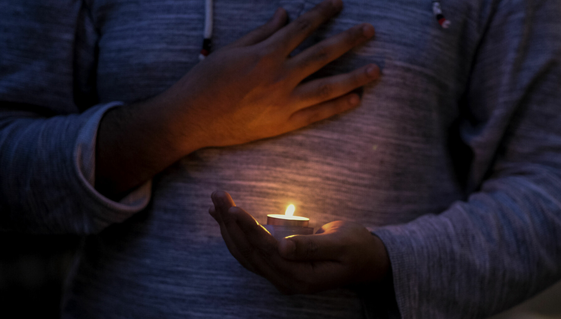 March 1, 2022, Los Angeles, California, USA: A student holds a candlelight during a vigil in support of Ukraine at University of Southern California in Los Angeles on March 1, 2022.